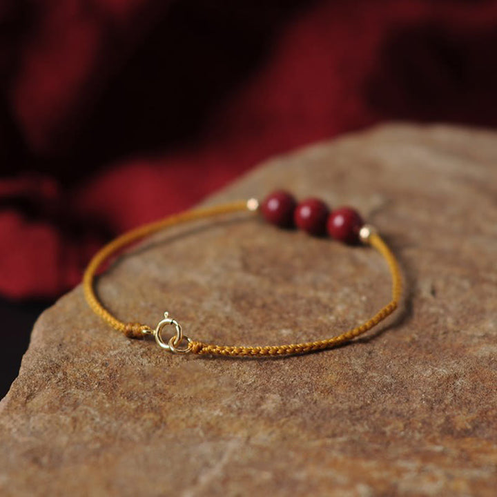 Pulsera trenzada con cadena de bendición de cinabrio natural chapada en oro de 14 quilates con Buddha Stones