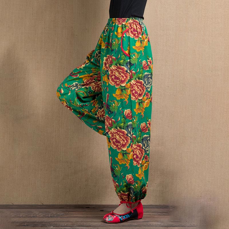 Pantalones bombachos con estampado de flores rojas y verdes de estilo étnico con Buddha Stones y bolsillos