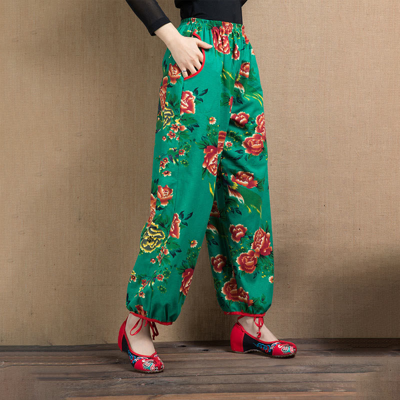 Pantalones bombachos con estampado de flores rojas y verdes de estilo étnico con Buddha Stones y bolsillos