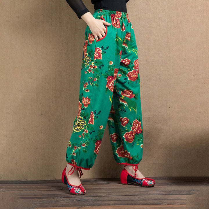Pantalones bombachos con estampado de flores rojas y verdes de estilo étnico con Buddha Stones y bolsillos