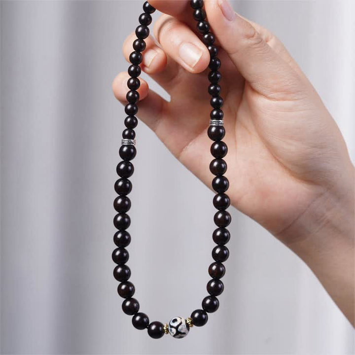 Pulsera de doble envoltura con cuentas Dzi de madera de ébano del Tíbet con Buddha Stones