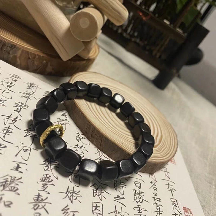 Pulsera de paz y calma con cuentas cuadradas de madera de ébano tibetano con Buddha Stones