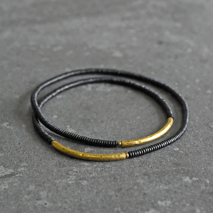 Pulsera multicapa con equilibrio de cobre y madera de ébano con Buddha Stones