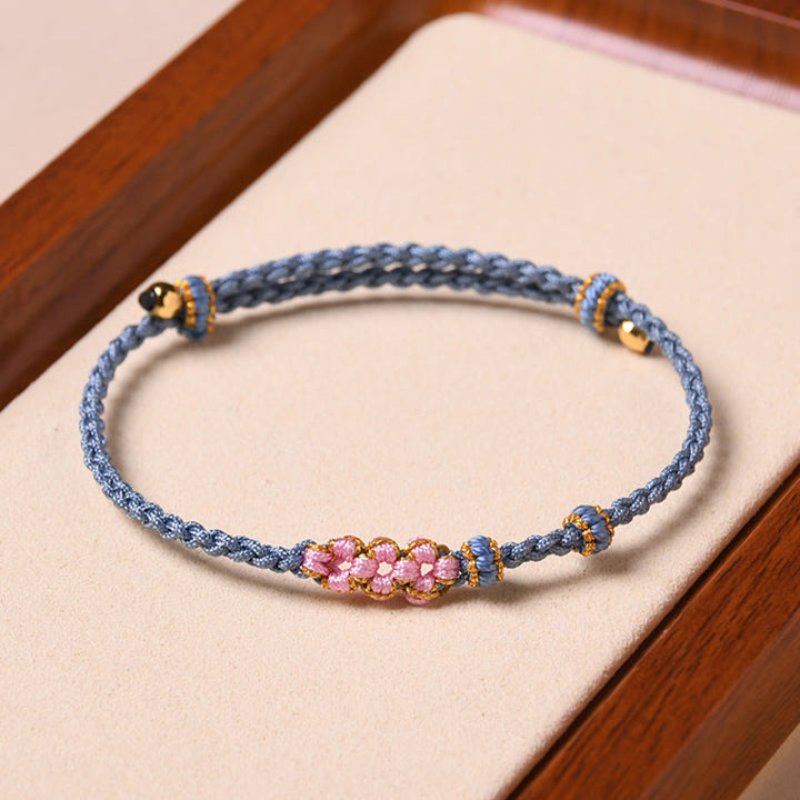Pulsera de cuerda trenzada con protección de flor de melocotón hecha a mano con Buddha Stones