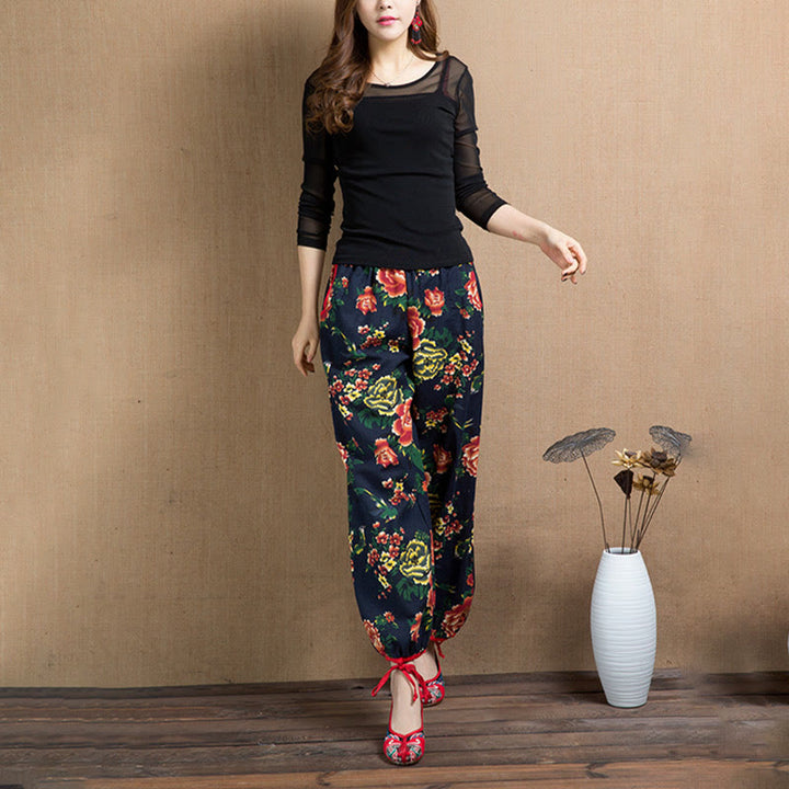 Pantalones bombachos con estampado de flores rojas y verdes de estilo étnico con Buddha Stones y bolsillos