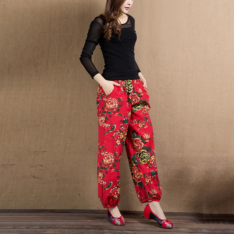 Pantalones bombachos con estampado de flores rojas y verdes de estilo étnico con Buddha Stones y bolsillos