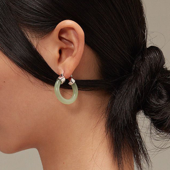Pendientes de prosperidad de jade blanco redondo de Buddha Stones