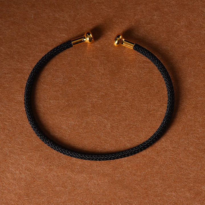 Pulsera de cuerda trenzada de la suerte hecha a mano con diseño simple de Buddha Stones