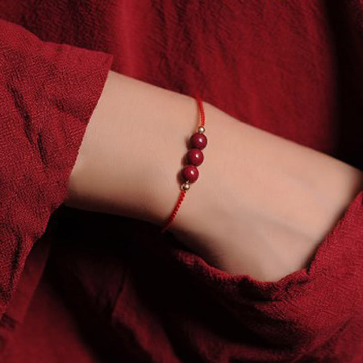 Pulsera trenzada con cadena de bendición de cinabrio natural chapada en oro de 14 quilates con Buddha Stones