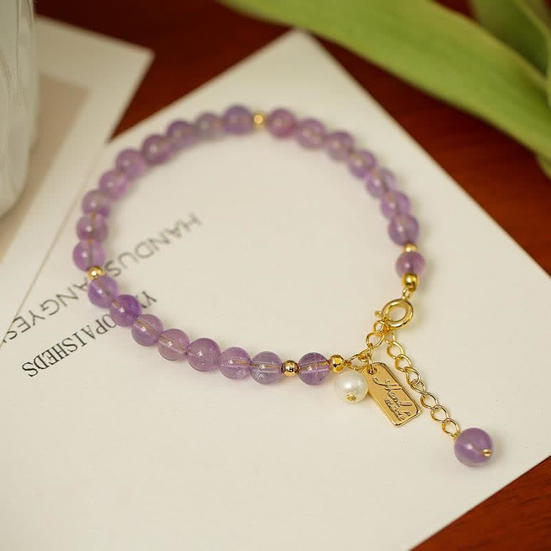 Pulsera de cristal de amatista natural que alivia el estrés.
