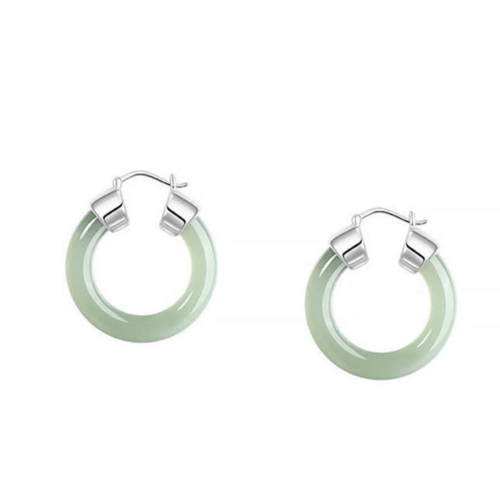 Pendientes de prosperidad de jade blanco redondo de Buddha Stones
