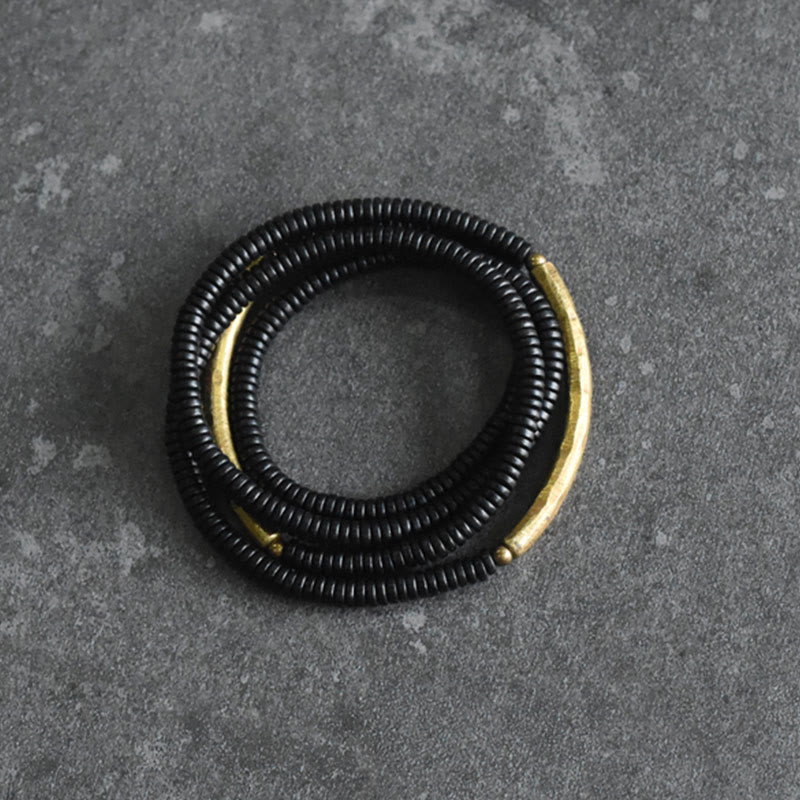 Pulsera multicapa con Buddha Stones, madera de ébano, latón y cobre - image 5