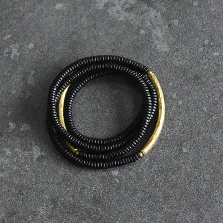 Pulsera multicapa con Buddha Stones, madera de ébano, latón y cobre - image 5