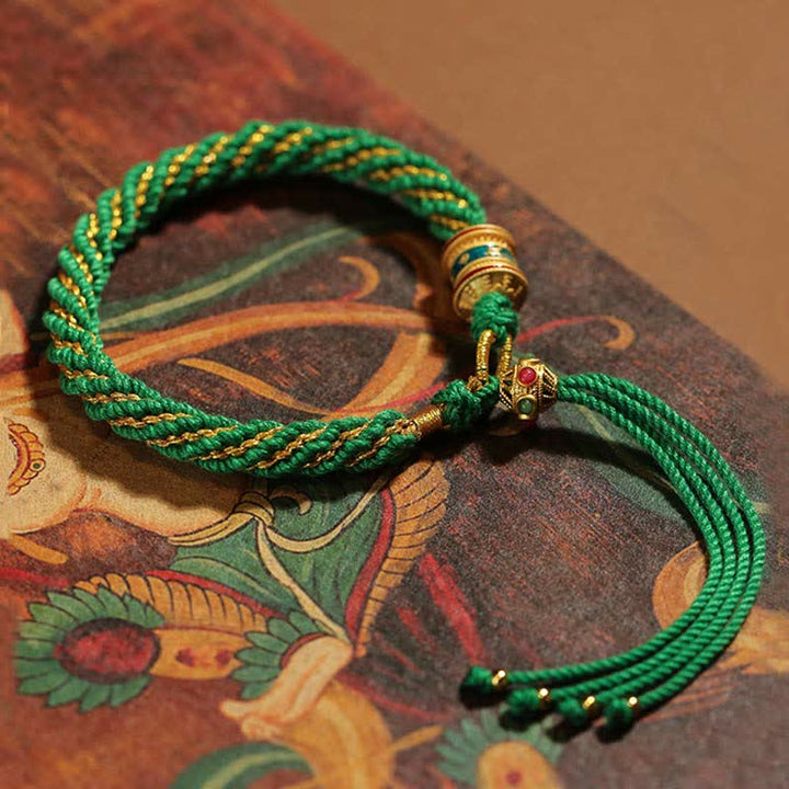 Pulsera de cuerda tejida con dije de rueda de oración Thangka de la suerte hecha a mano tibetana con Buddha Stones