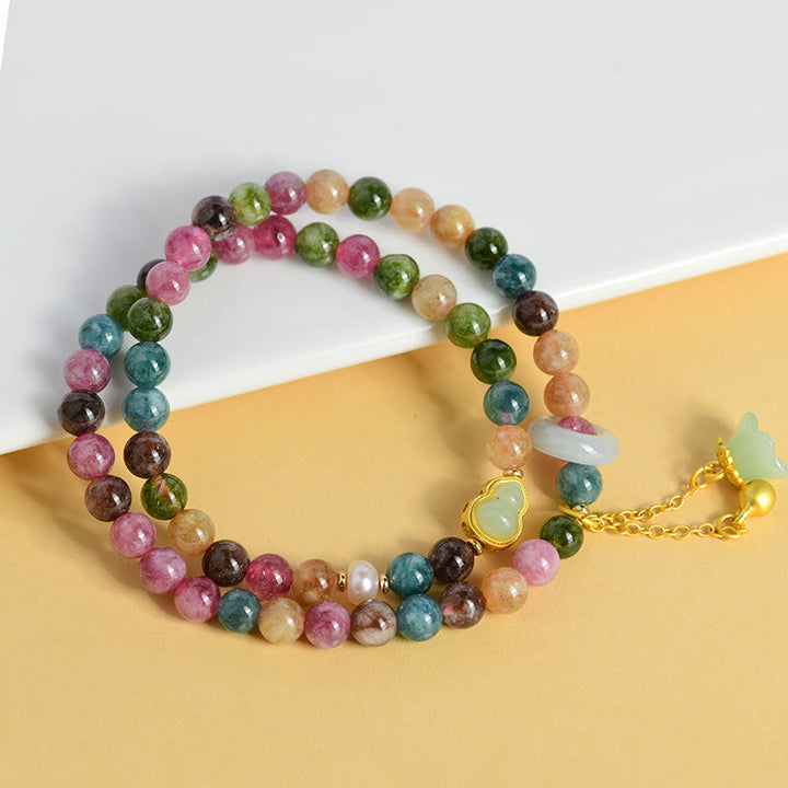 Pulsera con dije de lirio de los valles de doble envoltura de sabiduría de calabaza de turmalina multicolor con Buddha Stones