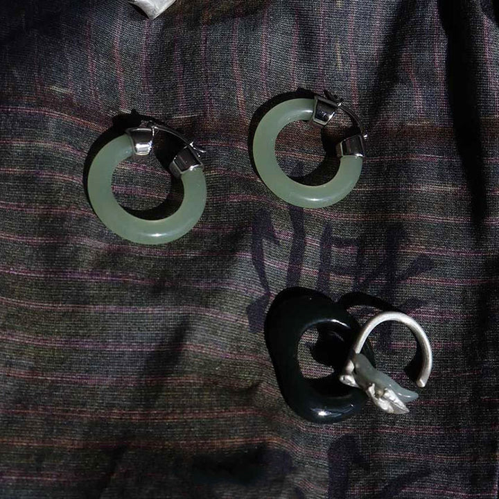 Pendientes de prosperidad de jade blanco redondo de Buddha Stones