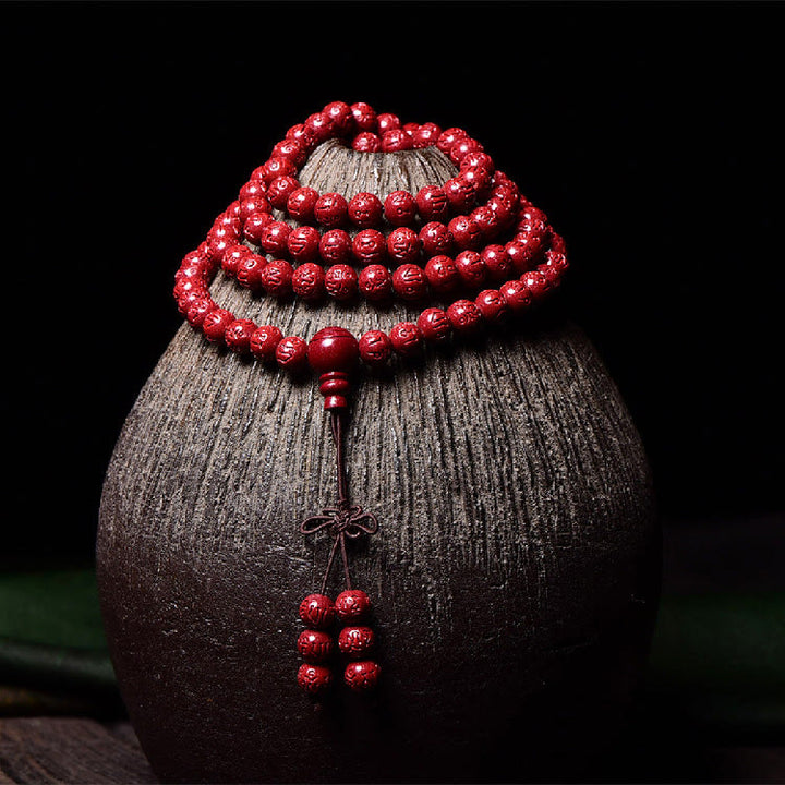 Buddha Stones 108 cuentas Mala cinabrio Om Mani Padme Hum patrón grabado pulsera de bendición
