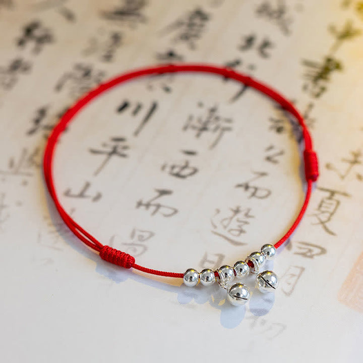 Tobillera con dije de campana trenzada con hilo rojo de plata de ley 925 con Buddha Stones