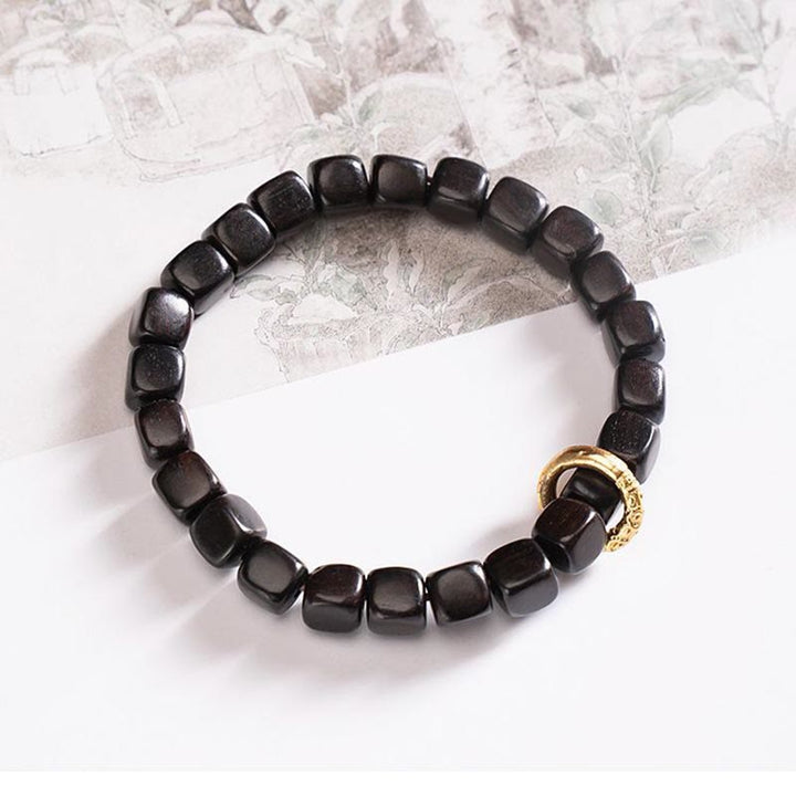 Pulsera de equilibrio de cuentas Dzi de madera de ébano tibetano con Buddha Stones
