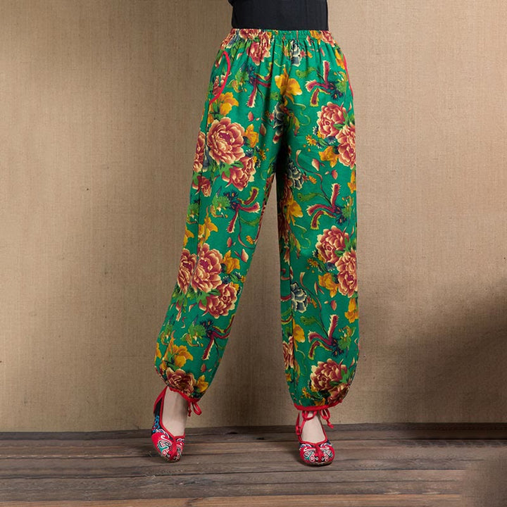 Pantalones bombachos con estampado de flores rojas y verdes de estilo étnico con Buddha Stones y bolsillos