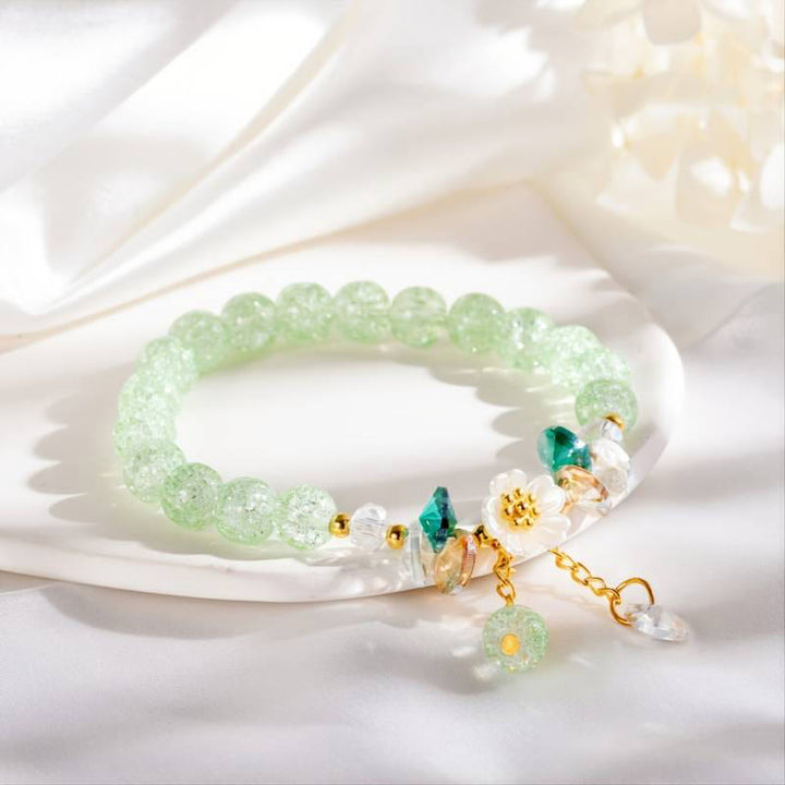 Pulsera de cuentas de cristal con dije de flor de diseño simple con Buddha Stones