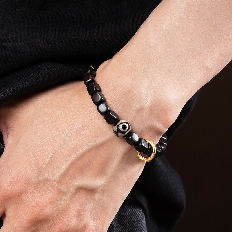 Pulsera de equilibrio de cuentas Dzi de madera de ébano tibetano con Buddha Stones