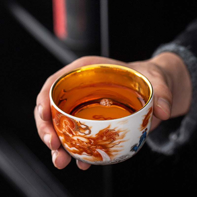 Buddha Stones Dragón Fénix Grulla Sol Océano Olas Taza de té de cerámica dorada Taza de té de Kung Fu 170 ml