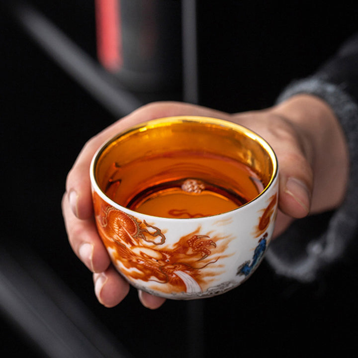 Buddha Stones Dragón Fénix Grulla Sol Océano Olas Taza de té de cerámica dorada Taza de té de Kung Fu 170 ml