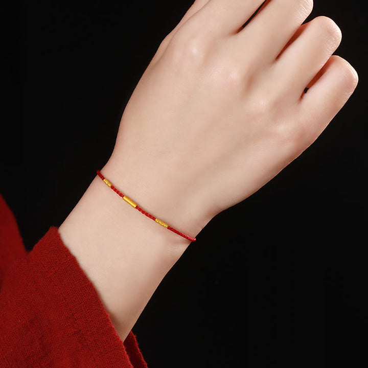 Pulsera de protección trenzada con nudos de los deseos de cuatro hilos hecha a mano con cuentas de oro 999 de Buddha Stones