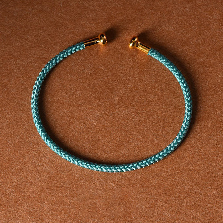 Pulsera de cuerda trenzada de la suerte hecha a mano con diseño simple de Buddha Stones