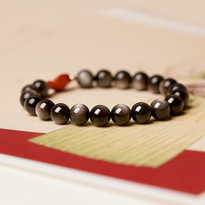 Pulsera de protección calmante con Buddha Stones , obsidiana con brillo de plata natural, cinabrio, pez Koi