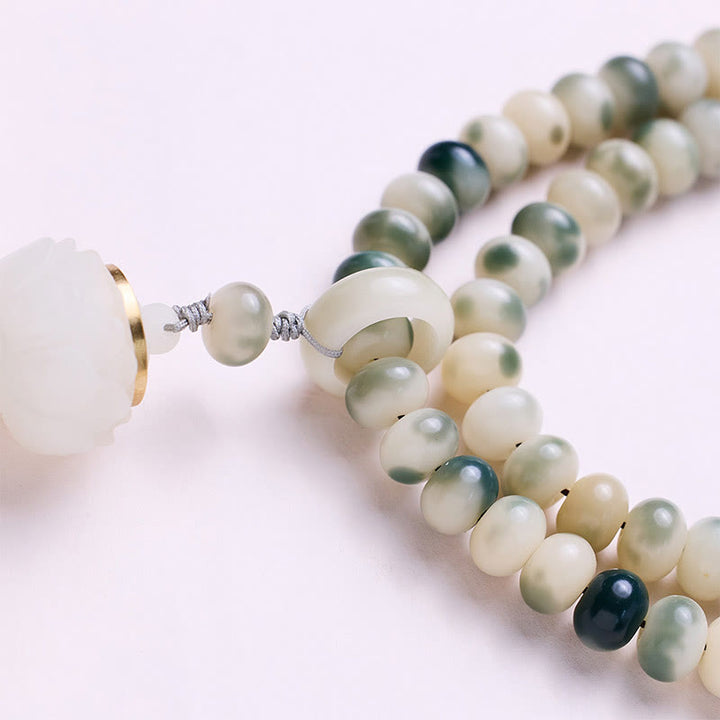 Buddha Stones Natural 108 cuentas Mala semilla Bodhi loto grabado sabiduría borla pulsera