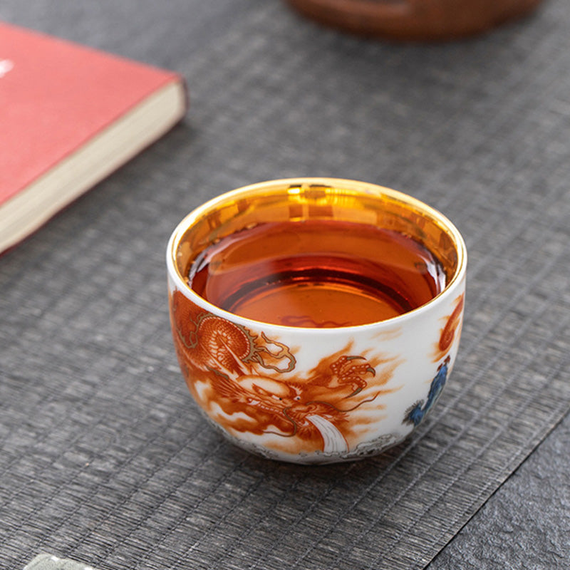 Buddha Stones Dragón Fénix Grulla Sol Océano Olas Taza de té de cerámica dorada Taza de té de Kung Fu 170 ml