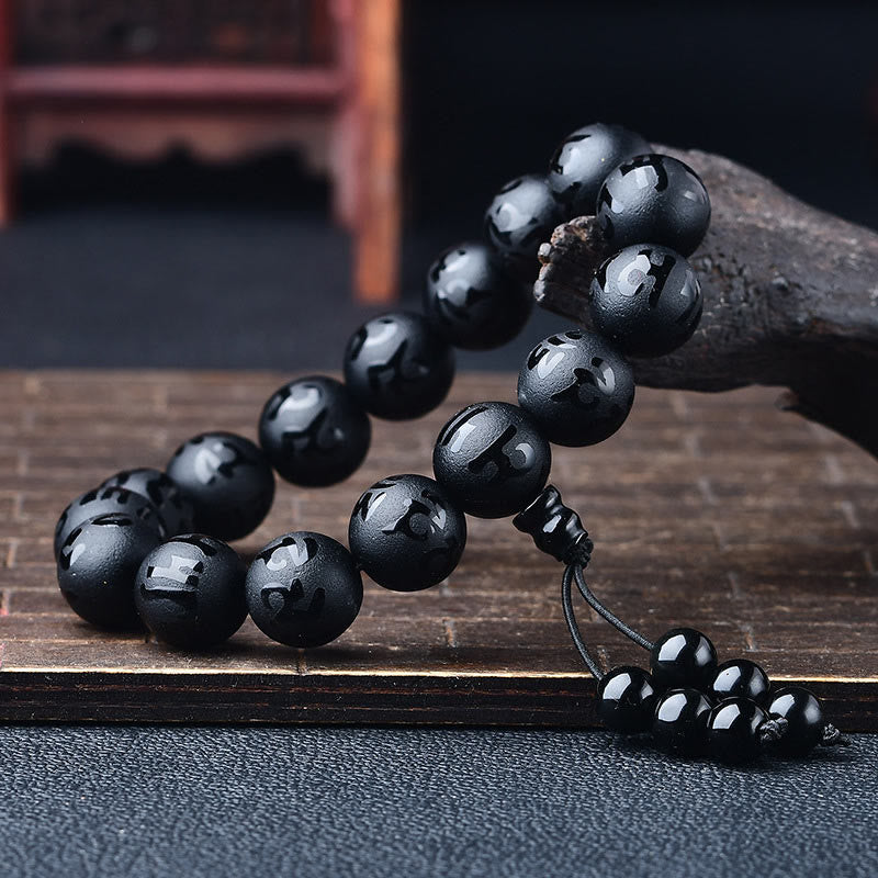 Pulsera de meditación Om Mani Padme Hum de ónix negro y cristal blanco del Tíbet con Buddha Stones