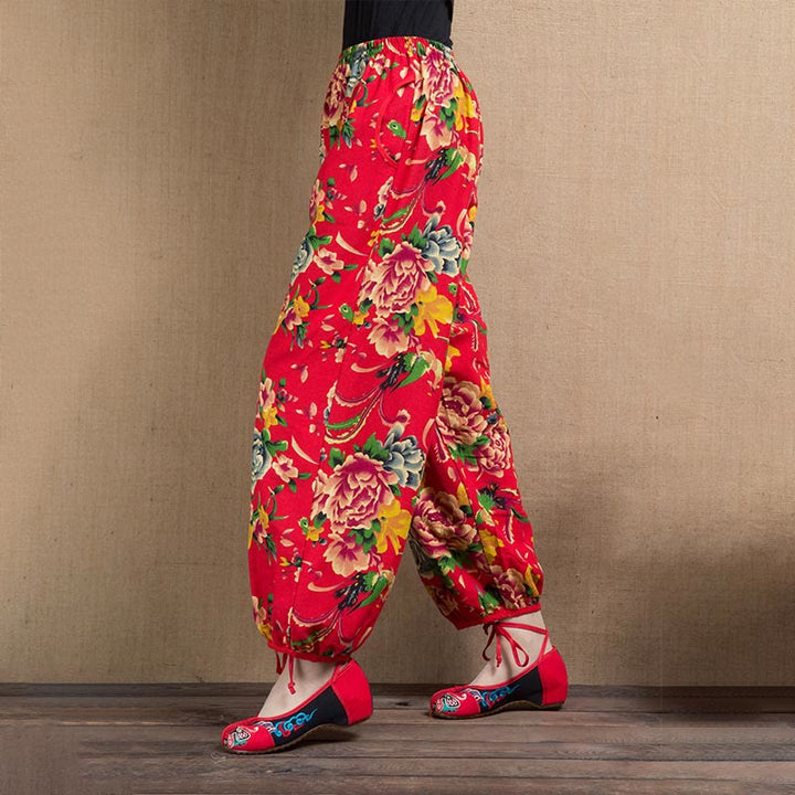 Pantalones bombachos con estampado de flores rojas y verdes de estilo étnico con Buddha Stones y bolsillos
