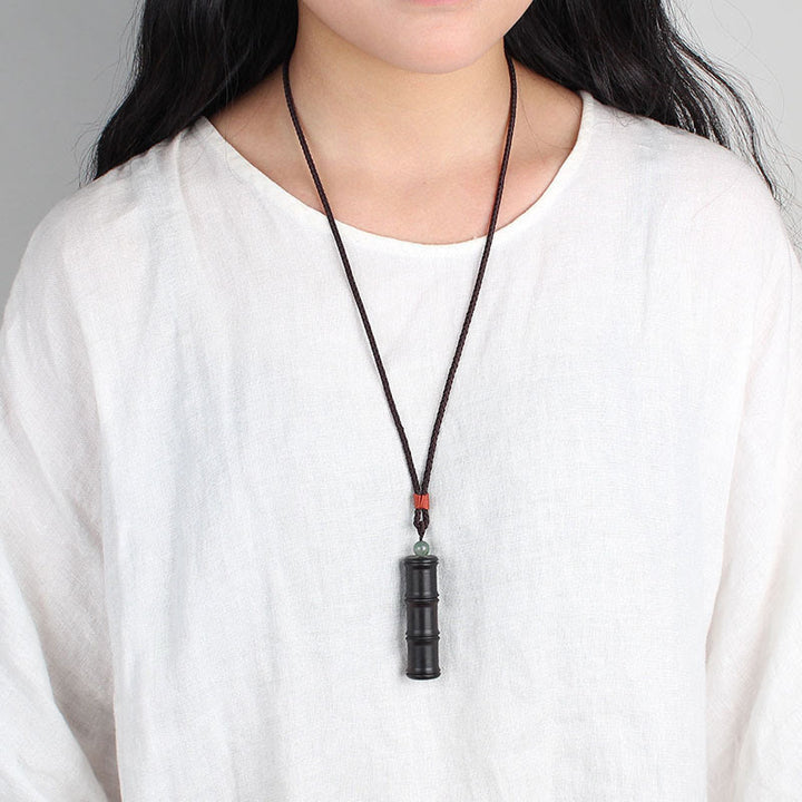 Buddha Stones madera de ébano patrón de bambú Ghau caja de oración collar de paz colgante