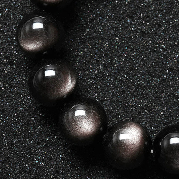 Pulsera de protección calmante de obsidiana brillante de plata natural con Buddha Stones