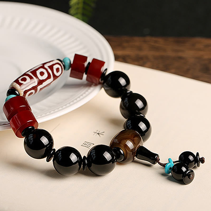 Pulsera tibetana de protección de la riqueza de ónix negro con cuentas Dzi de nueve ojos