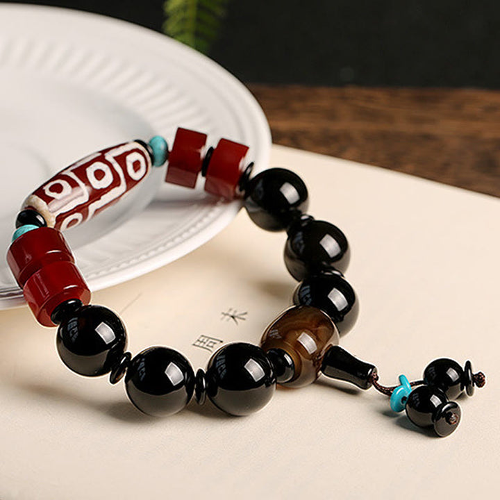 Pulsera tibetana de protección de la riqueza de ónix negro con cuentas Dzi de nueve ojos