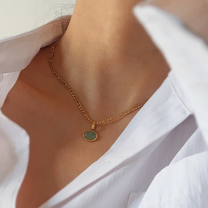 Colgante de collar de acero de titanio de fuerza turquesa ovalada