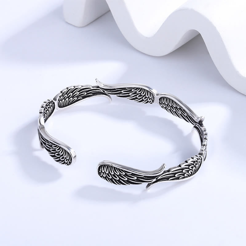 Brazalete de pulsera de la suerte tallada con patrón de plumas de alas de ángel de Buddha Stones