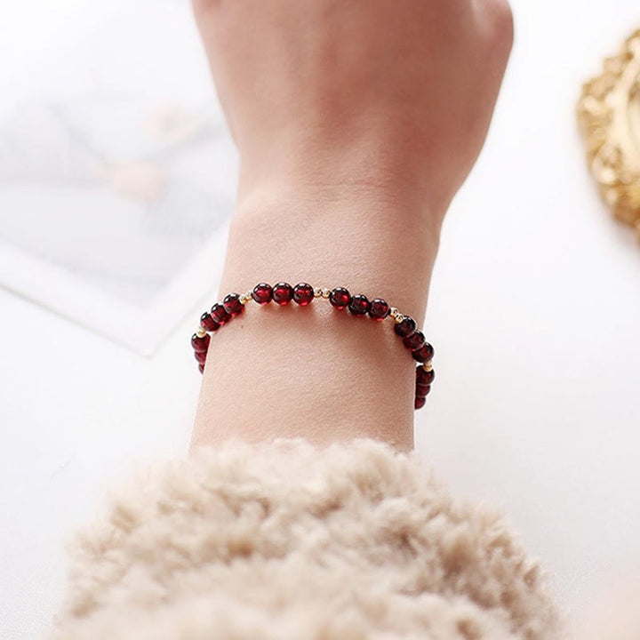 Pulsera Calm de granate natural de oro de 14 quilates con Buddha Stones