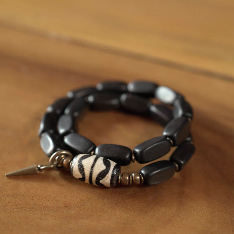 Pulsera de doble envoltura con cuentas Dzi de madera de ébano del Tíbet con Buddha Stones