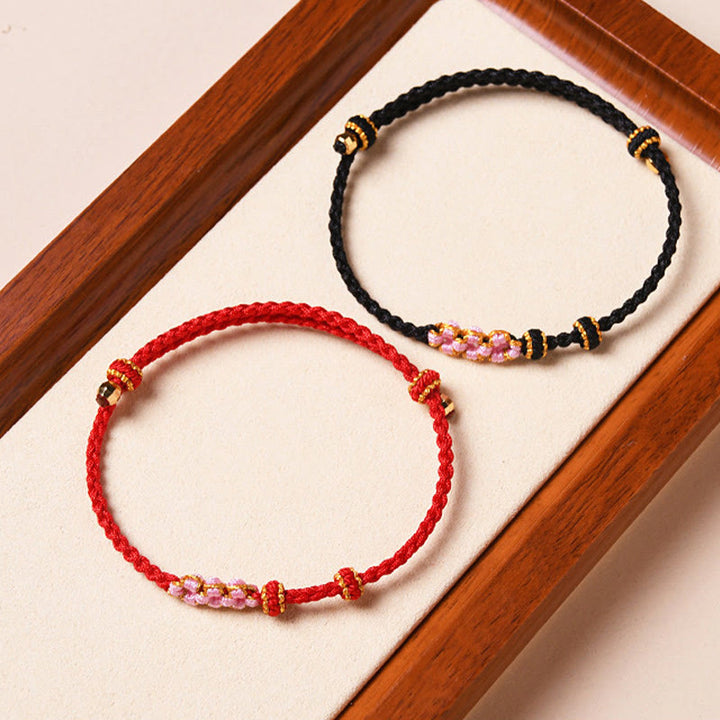 Pulsera de cuerda trenzada con protección de flor de melocotón hecha a mano con Buddha Stones