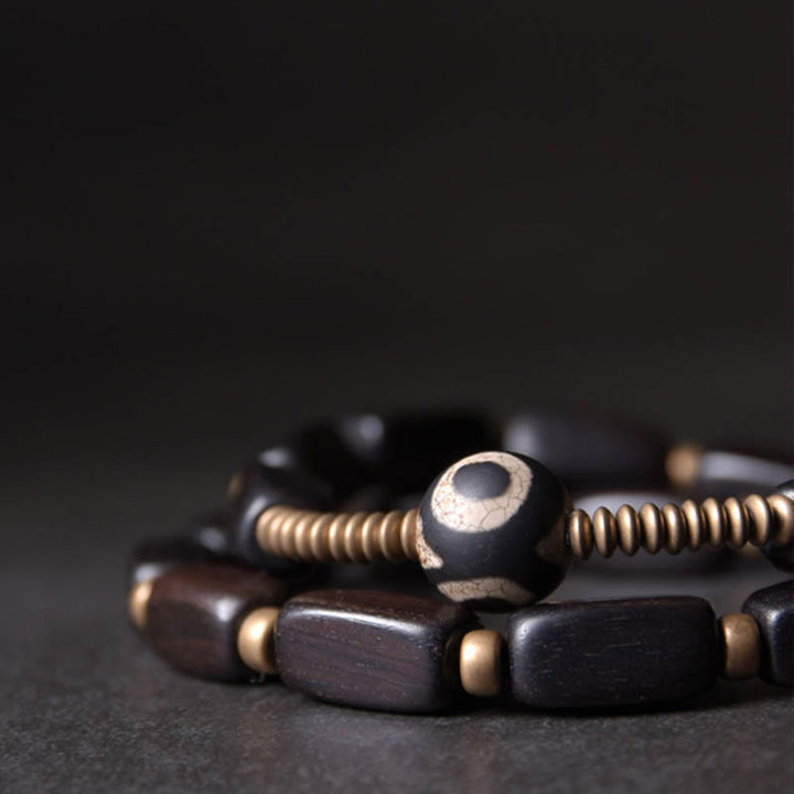 Pulsera de doble envoltura con cuentas Dzi de madera de ébano del Tíbet con Buddha Stones