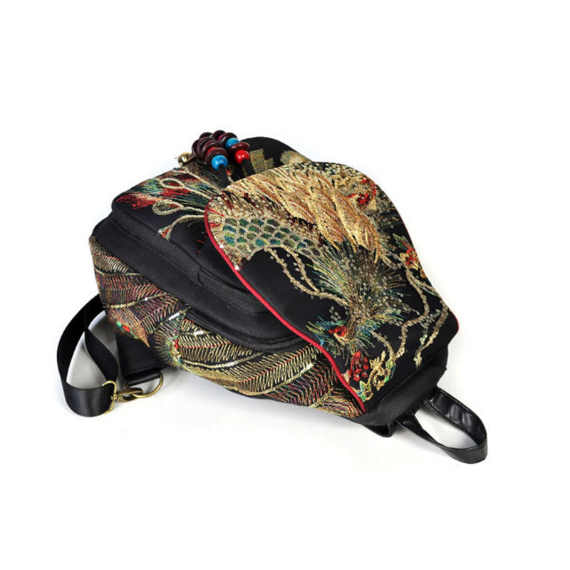 Mochila con borlas de lona con bordado de pavo real