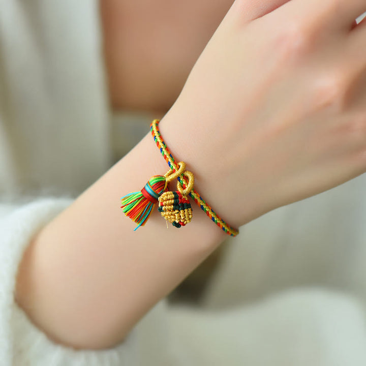 Pulsera con dije de bola dorada Zongzi hecha a mano con cuerda colorida y Buddha Stones