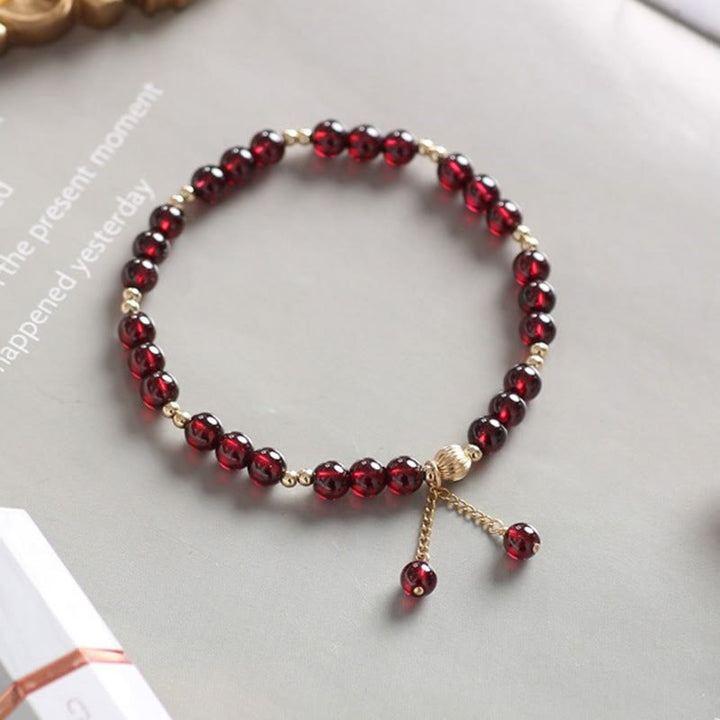 Pulsera Calm de granate natural de oro de 14 quilates con Buddha Stones