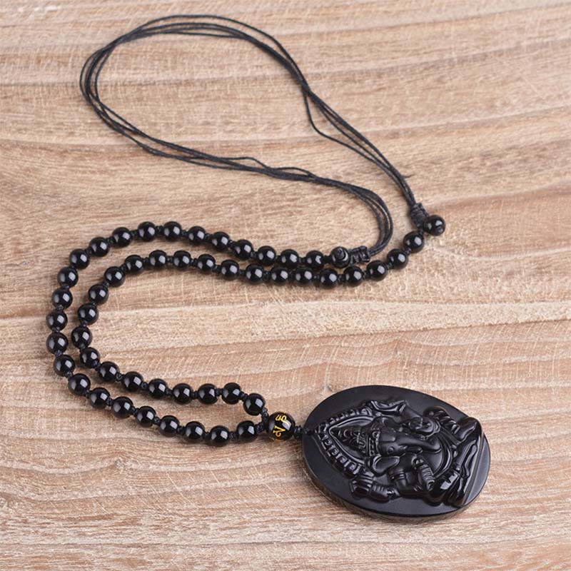Collar con amuleto de riqueza de elefante Ganesh Ganpati de obsidiana tibetana con Buddha Stones