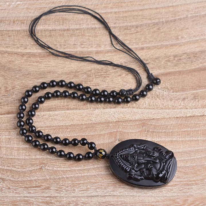 Collar con amuleto de riqueza de elefante Ganesh Ganpati de obsidiana tibetana con Buddha Stones